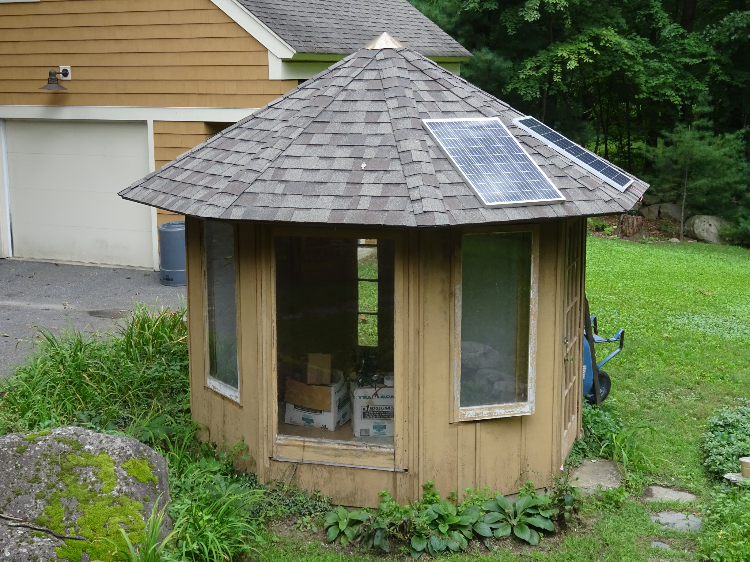 charge controller, battery, and inverter mounted to plywood